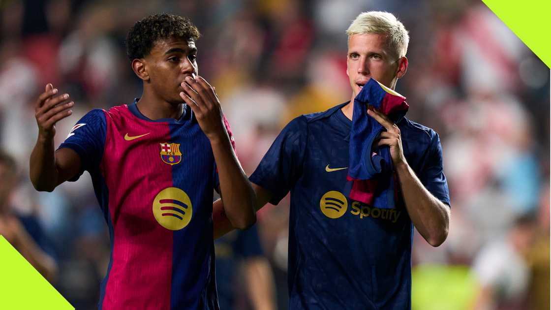 Dani Olmo speaks with Lamine Yamal during Barcelona's La Liga match against Rayo Vallecano on August 27, 2024.