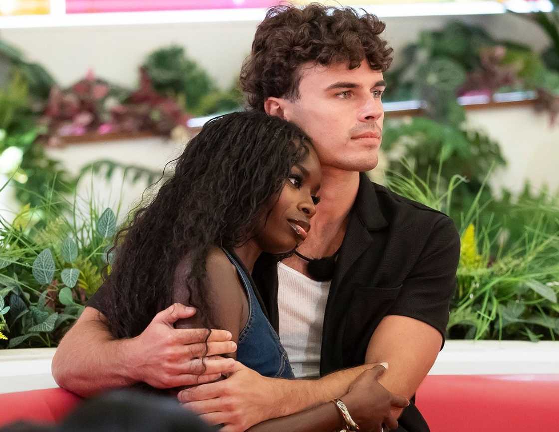 Nicolas Vansteenberghe and Olandria Carthen hold each other