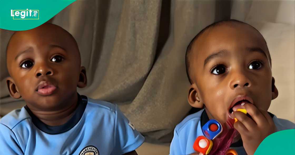 Twin boys wear Manchester City's jerseys for Nathaniel Bassey's Hallelujah challenge.