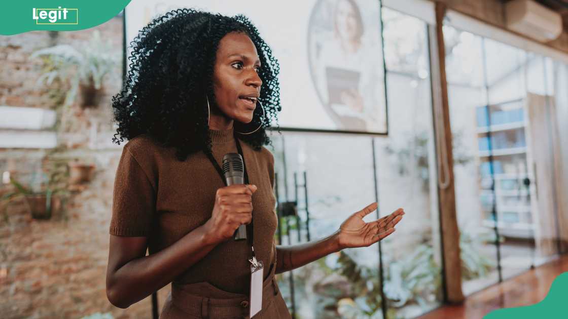 A lady giving a motivational talk A lady giving a motivational talk