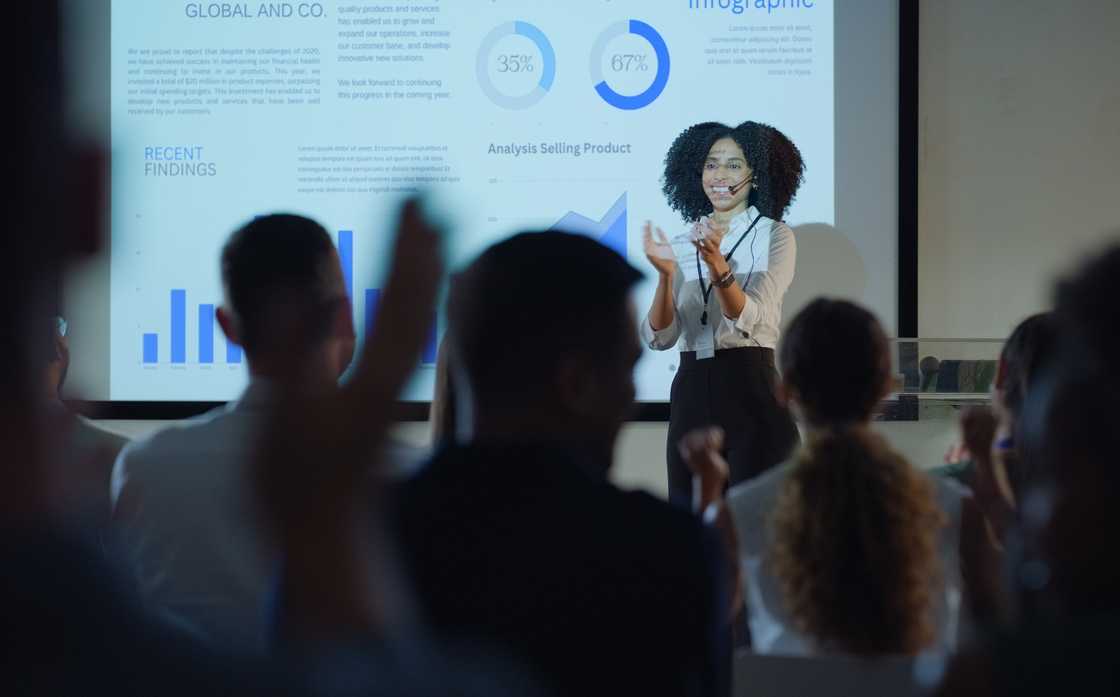 A trainer speaking to a crowd with confidence. A trainer speaking to a crowd with confidence.