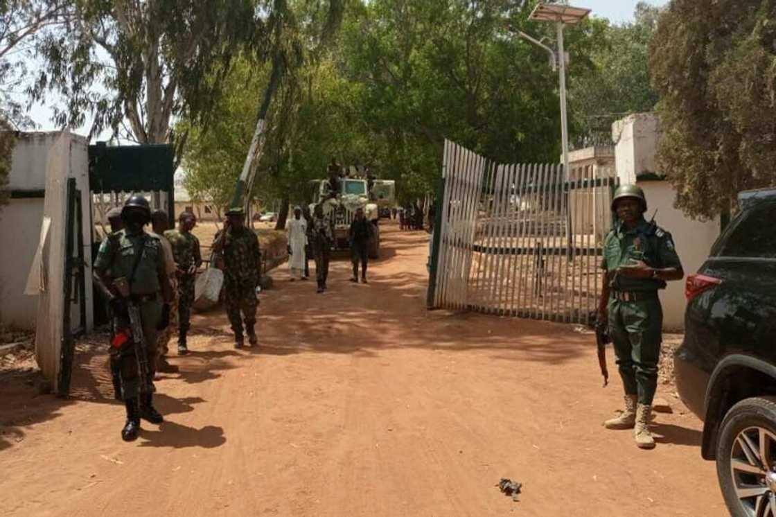 Nigerian soldiers and police guard the Federal College of Forestry Mechanisation in Kaduna state where a gang kidnapped 30 students in March, 2021 Nigerian soldiers and police guard the Federal College of Forestry Mechanisation in Kaduna state where a gang kidnapped 30 students in March, 2021