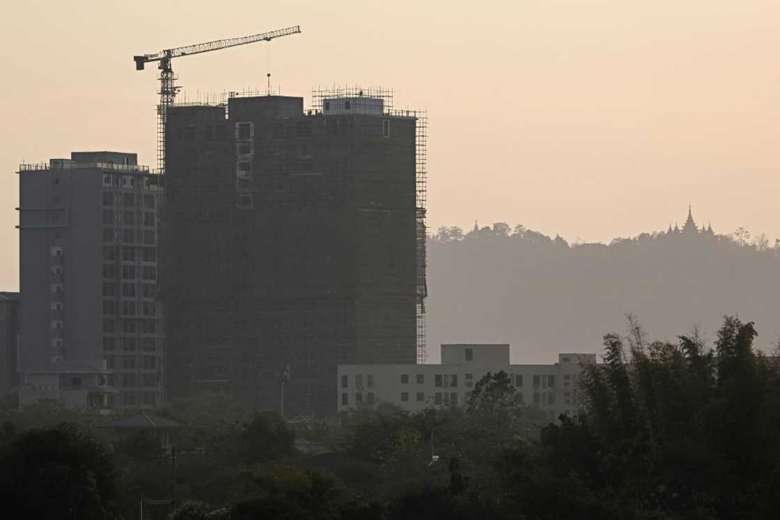 Work going on in February on a new tower block in Shwe Kokko, where some of the most notorious scam centres are based Work going on in February on a new tower block in Shwe Kokko, where some of the most notorious scam centres are based
