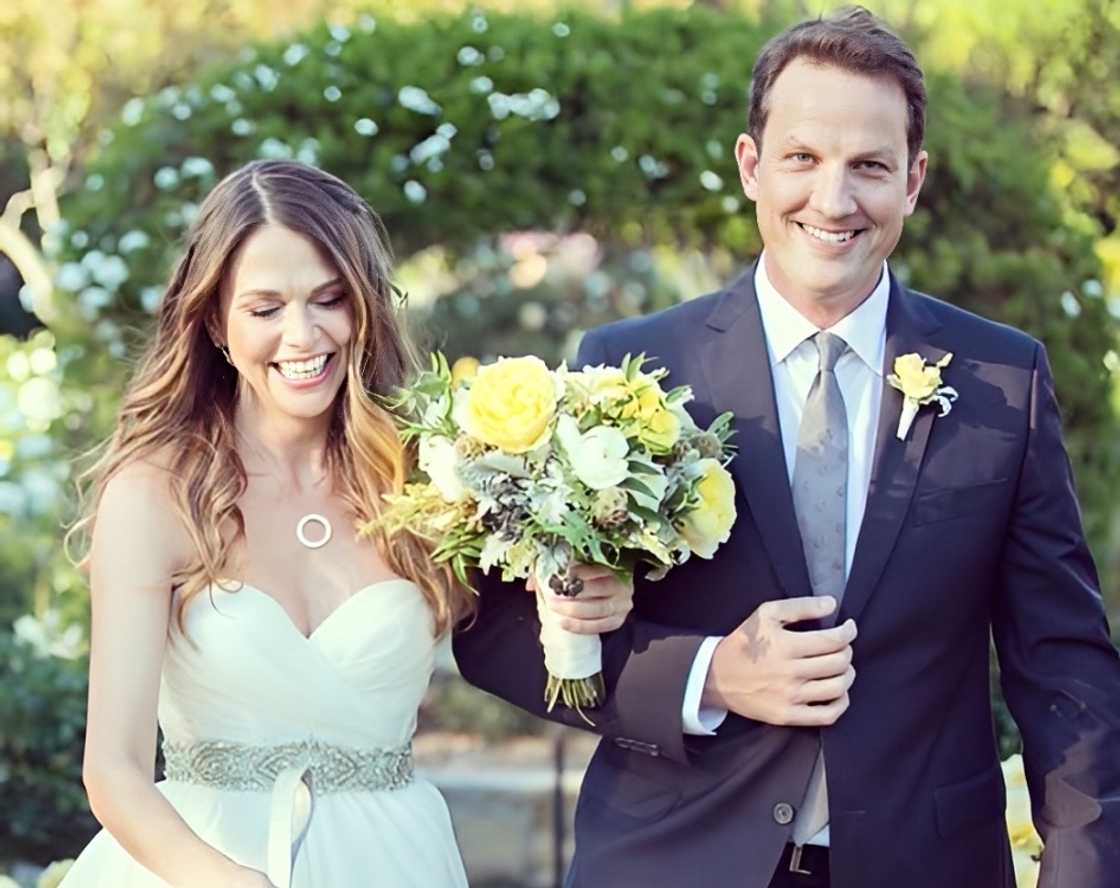 Sutton Foster walks with Ted Griffin, on their wedding day.
