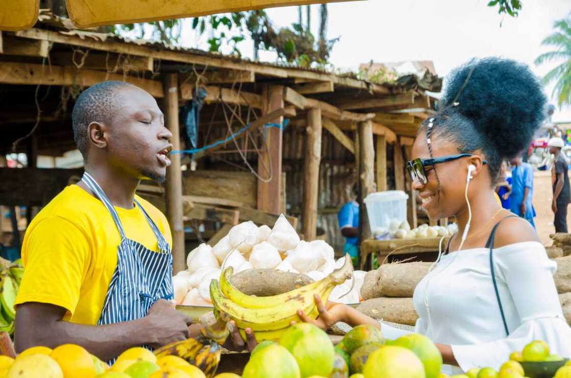 A Man Feeling Excited As He Sells To His Beautiful Customer A Man Feeling Excited As He Sells To His Beautiful Customer