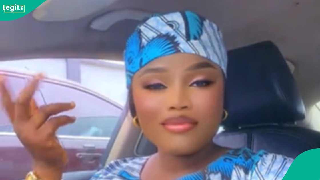 A lady shows the Christmas package she received from her company A lady shows the Christmas package she received from her company