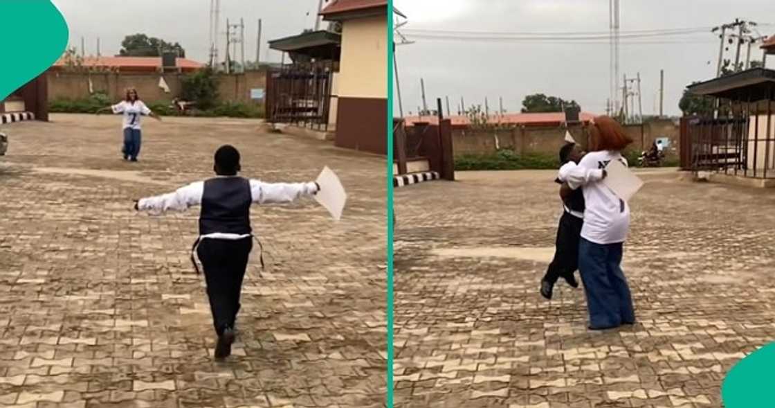 Lady overjoyed as her son with a babalawo graduates from school. Lady overjoyed as her son with a babalawo graduates from school.
