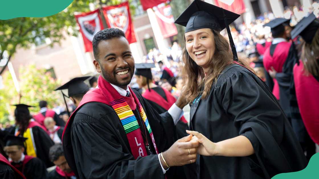 Harvard University graduates celebrating. Harvard University graduates celebrating.