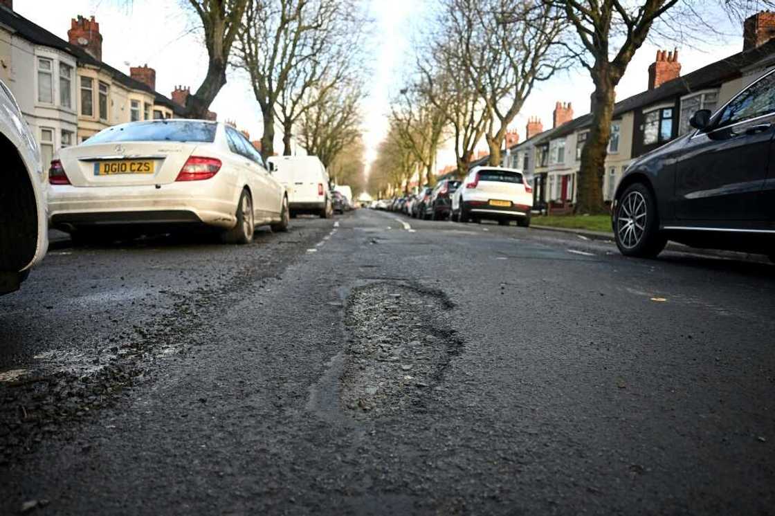 Potholes form when water seeps into cracks and freezes Potholes form when water seeps into cracks and freezes