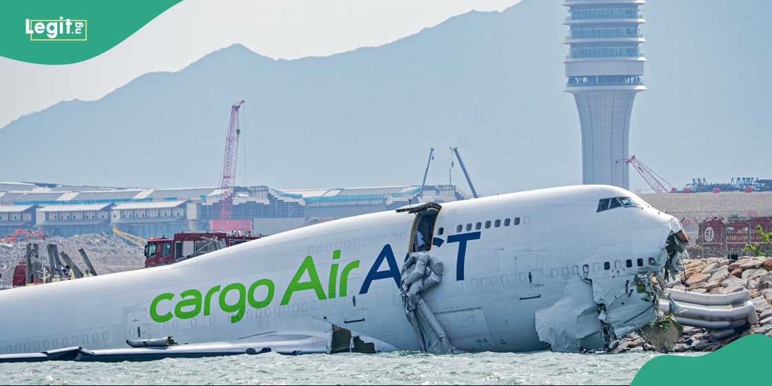 Rescue teams work around the submerged aircraft as investigations into the cause of the crash continue.