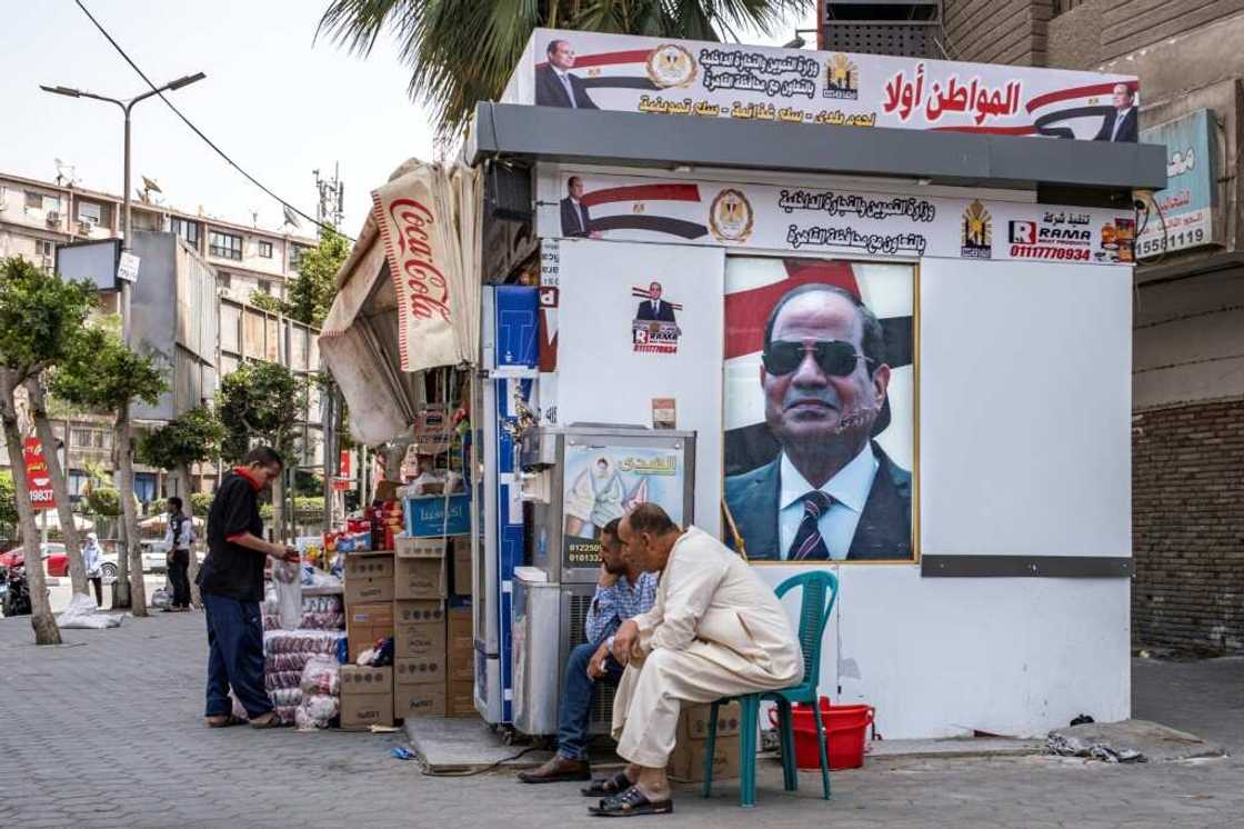 Portraits of Egypt's President Abdel Fattah al-Sisi adorn a stall in central Cairo for the government-sponsored "Citizen First" initiative, which aims to sell basic goods at reduced prices Portraits of Egypt's President Abdel Fattah al-Sisi adorn a stall in central Cairo for the government-sponsored "Citizen First" initiative, which aims to sell basic goods at reduced prices
