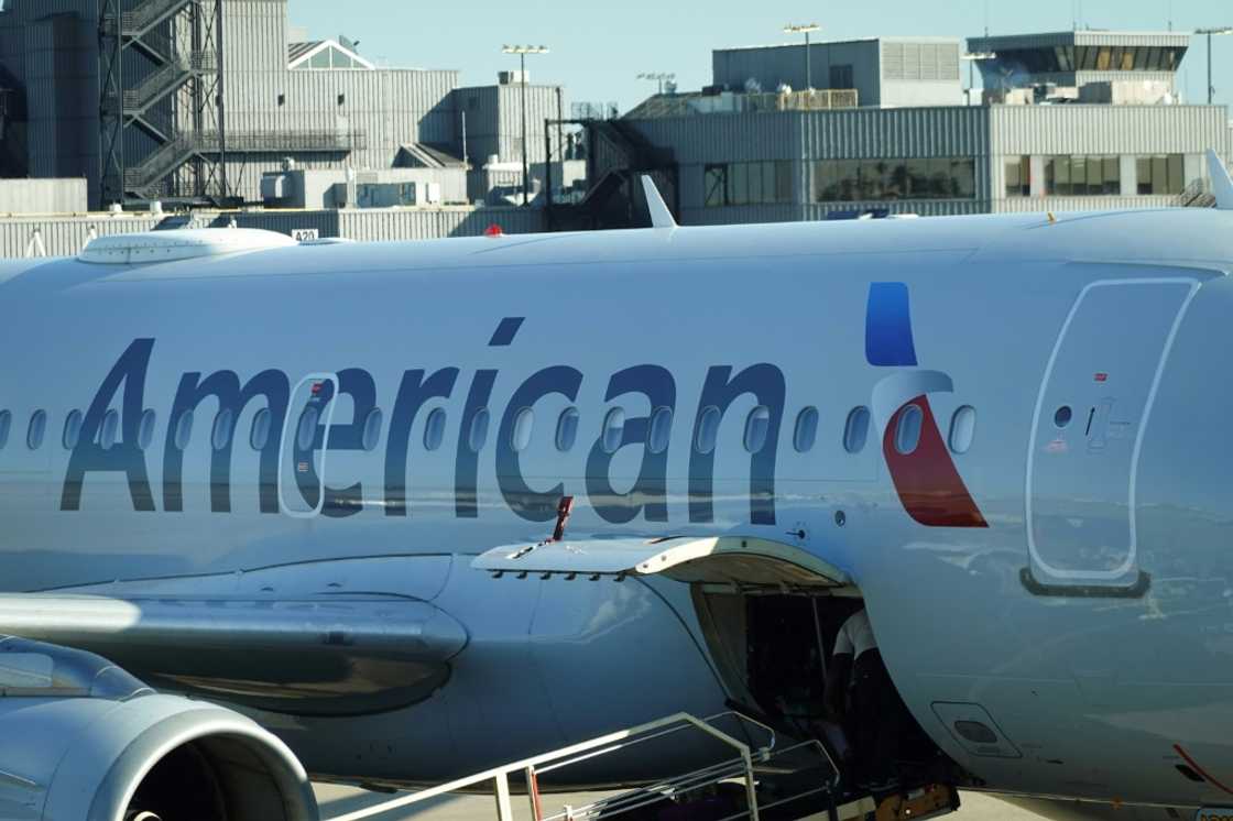 American Airlines reported a third-quarter loss, but said efforts to restore bookings programs with travel agencies are on track