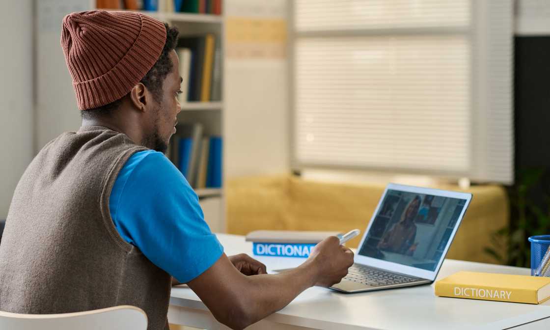 A college student uses a laptop to study.