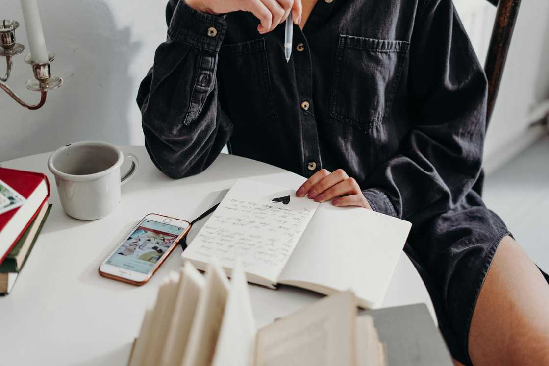 A woman and reading a journal