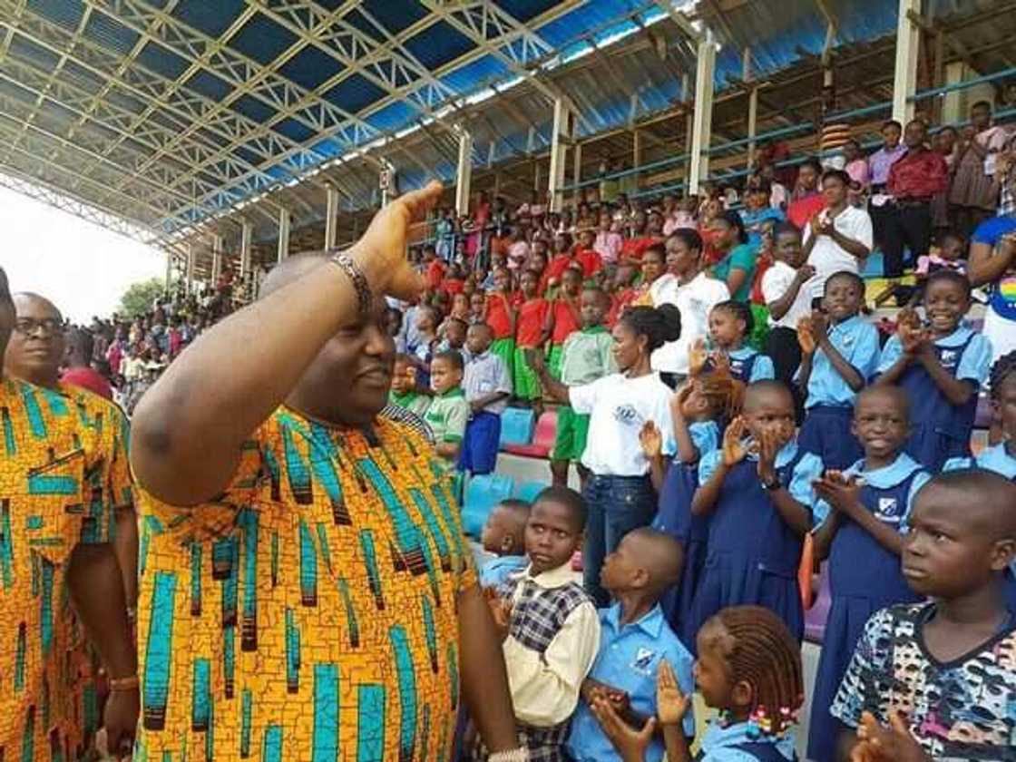 Senator Ubah greeting a crowd of children