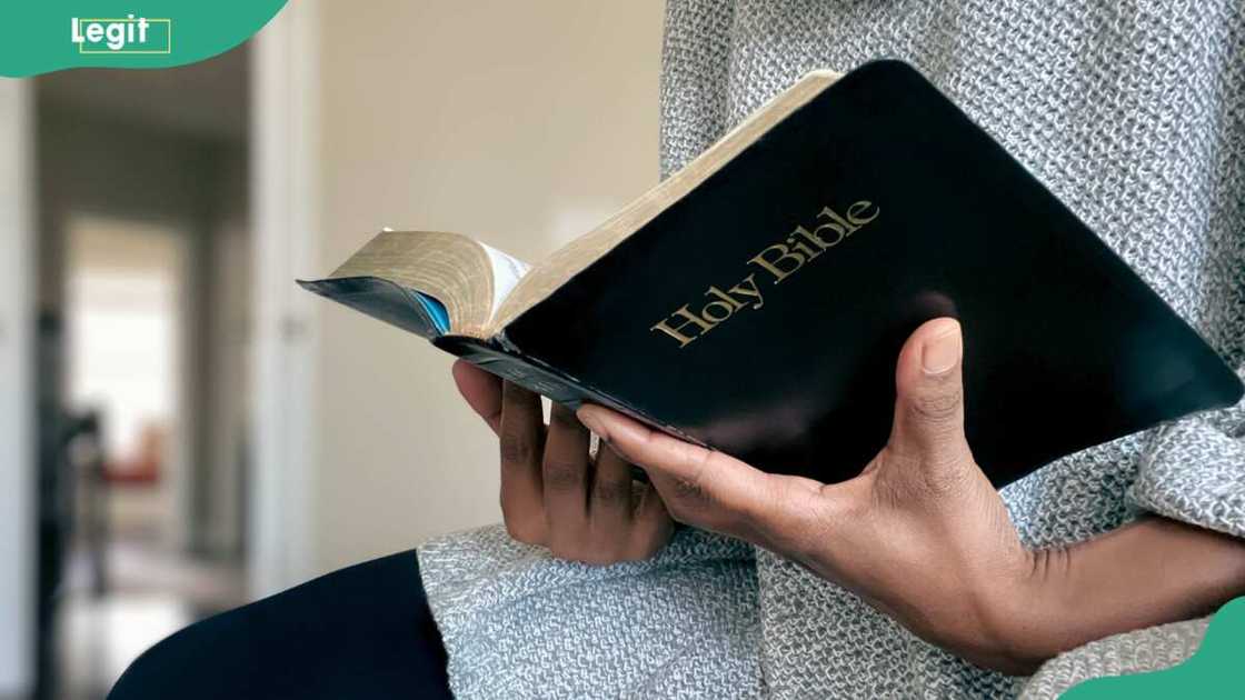 A close-up of a woman reading the Bible