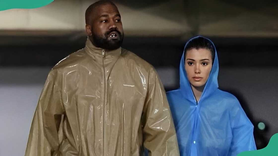 Kanye West and Bianca Censori dressed in rain coats Kanye West and Bianca Censori dressed in rain coats