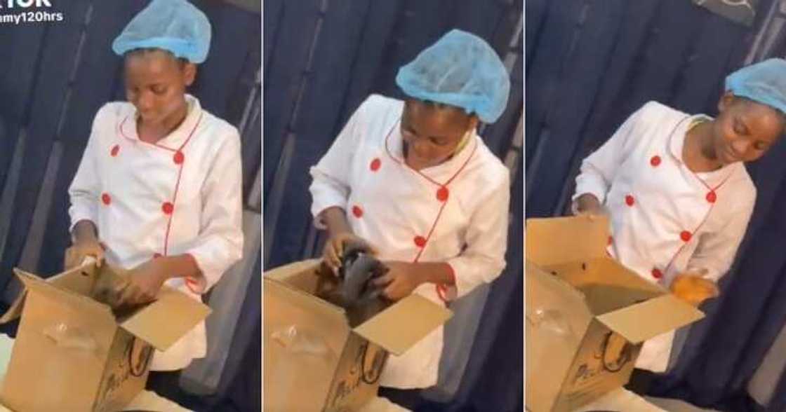 Chef Dammy receives carton of fish at cook-a-thon venue