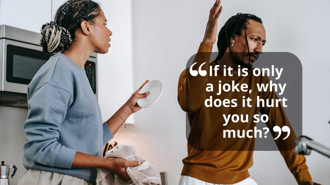 Couple arguing in a kitchen while holding dishes. Couple arguing in a kitchen while holding dishes.