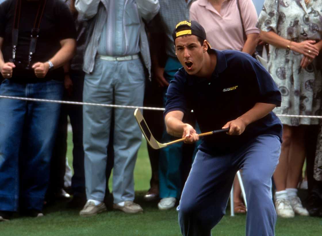 Adam Sandler celebrates while playing golf