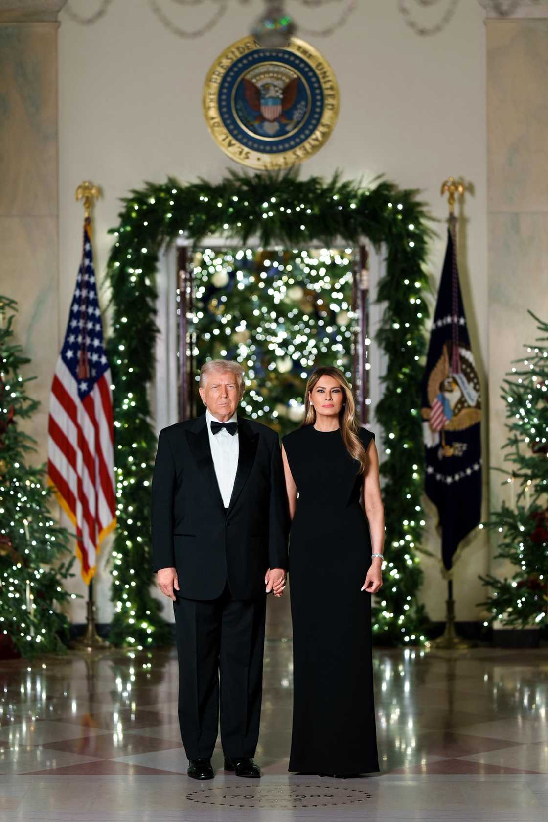 President Donald Trump and First Lady Melania Trump present their official White House Christmas portrait in elegant black attire. President Donald Trump and First Lady Melania Trump present their official White House Christmas portrait in elegant black attire.