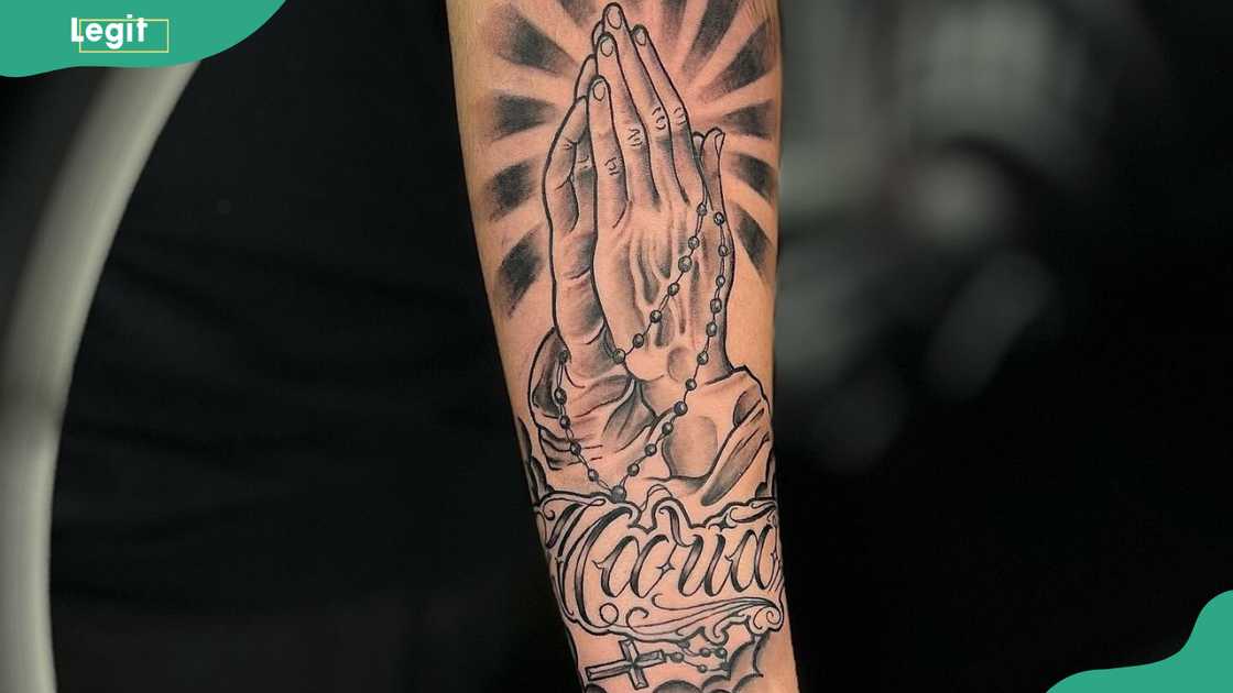 Praying hands tattoo Praying hands tattoo