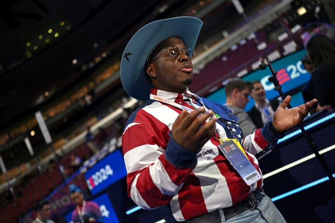 A social media influencer gives an interview on the third day of the Democratic National Convention (DNC) at the United Center in Chicago, Illinois, on August 21, 2024 A social media influencer gives an interview on the third day of the Democratic National Convention (DNC) at the United Center in Chicago, Illinois, on August 21, 2024