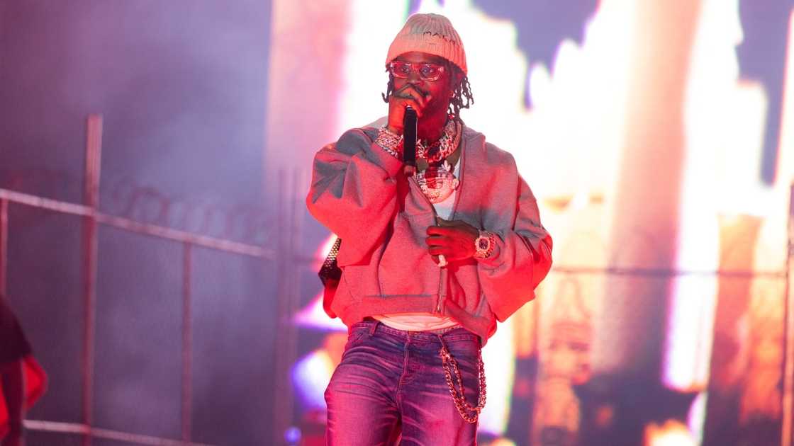 Chief Keef performs on a stage. Chief Keef performs on a stage.