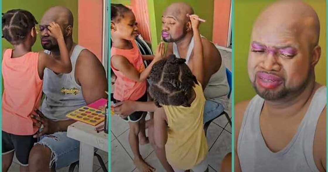 Little girls use make-up to decorate dad's face Little girls use make-up to decorate dad's face