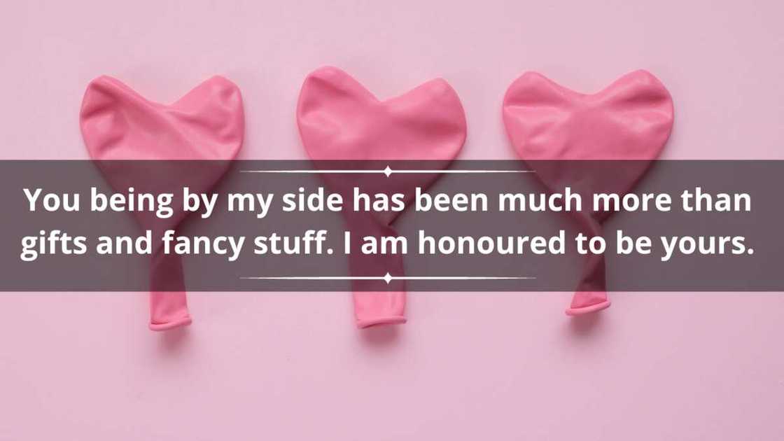 Deflated pink balloons in the shape of hearts against a pink background Deflated pink balloons in the shape of hearts against a pink background