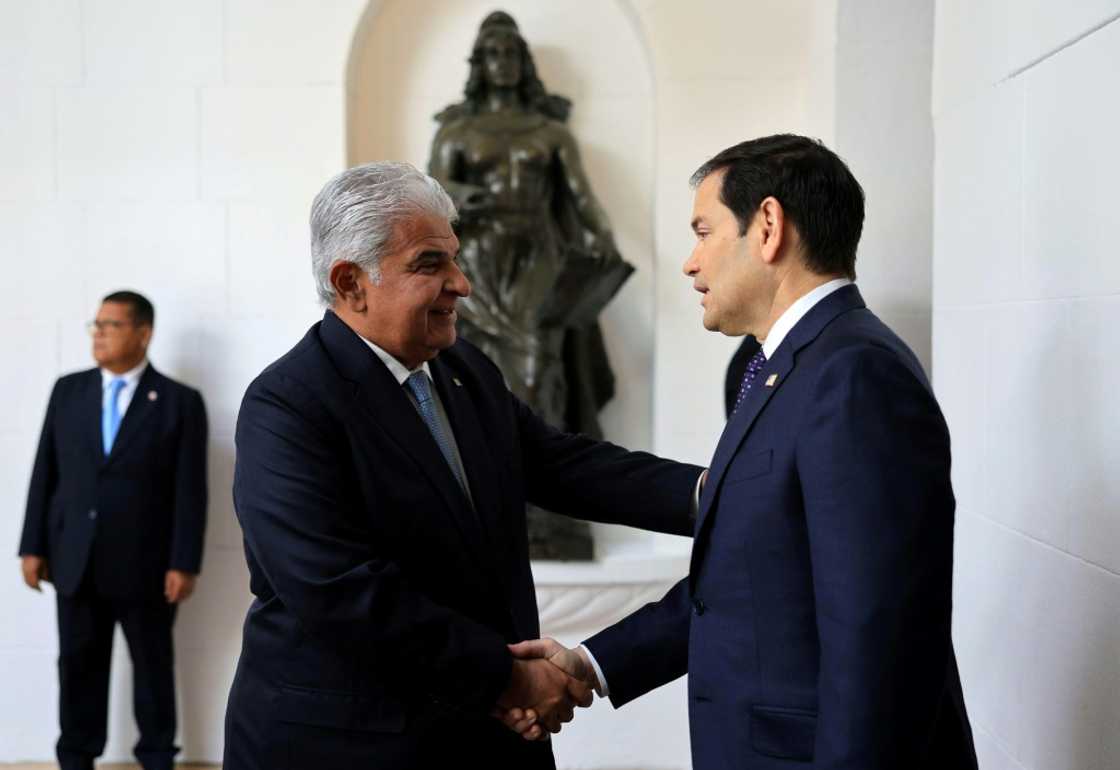 Panama's President Jose Raul Mulino (L) greets US Secretary of State Marco Rubio on arrival at the presidential palace in Panama City on February 2, 2025