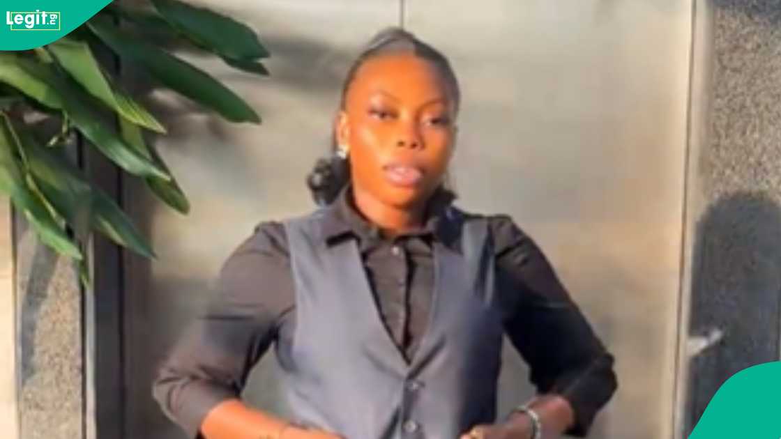 A lady shows what she gets as Christmas bonus at the work she is working. A lady shows what she gets as Christmas bonus at the work she is working.