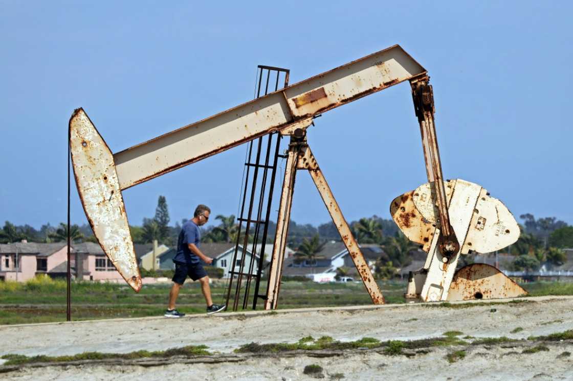 A warning about Russian output sent oil prices surging more than two percent Friday A warning about Russian output sent oil prices surging more than two percent Friday