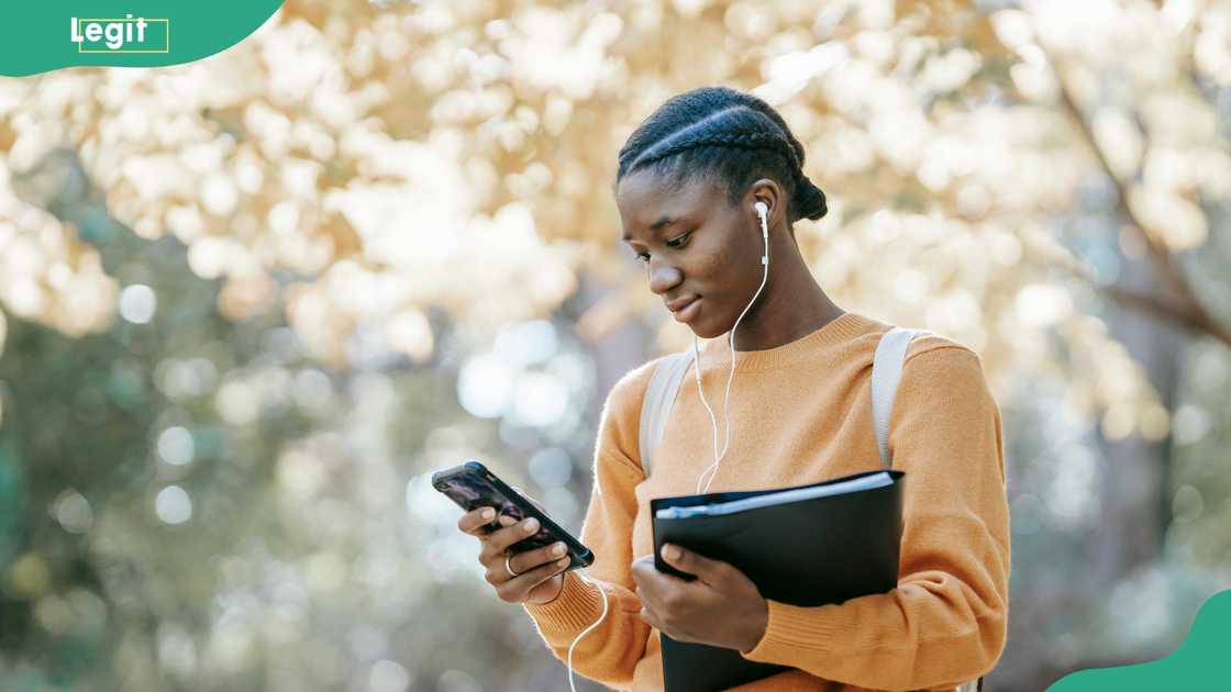 A student checks her phone