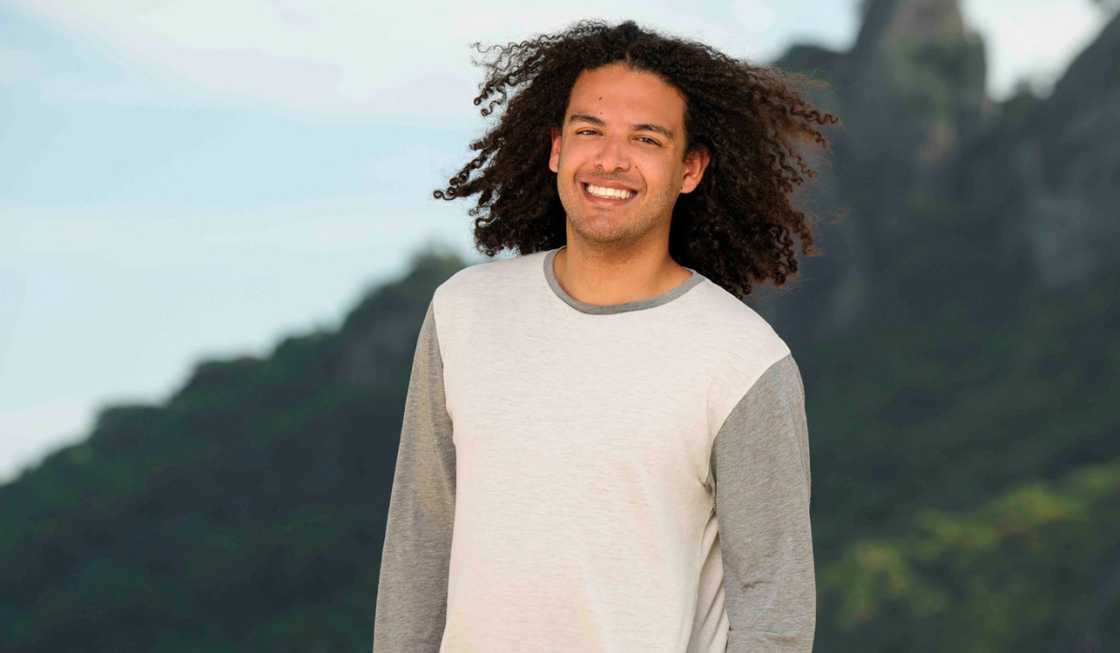 Gabe Ortis poses against a hilly background Gabe Ortis poses against a hilly background