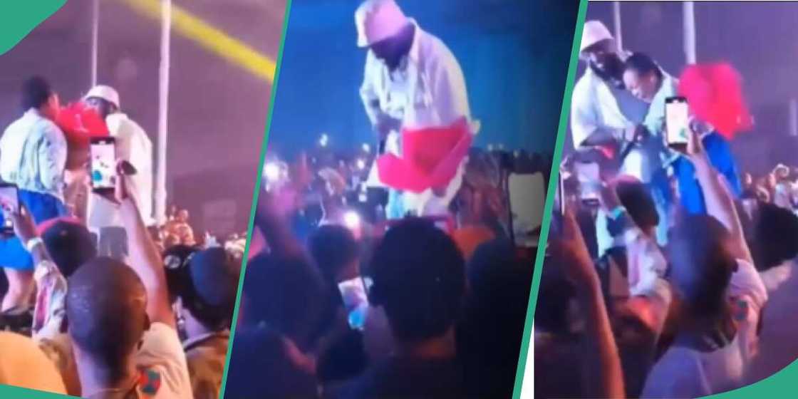 Davido hugs female fan who gave him flowers during his Asaba concert. Davido hugs female fan who gave him flowers during his Asaba concert.