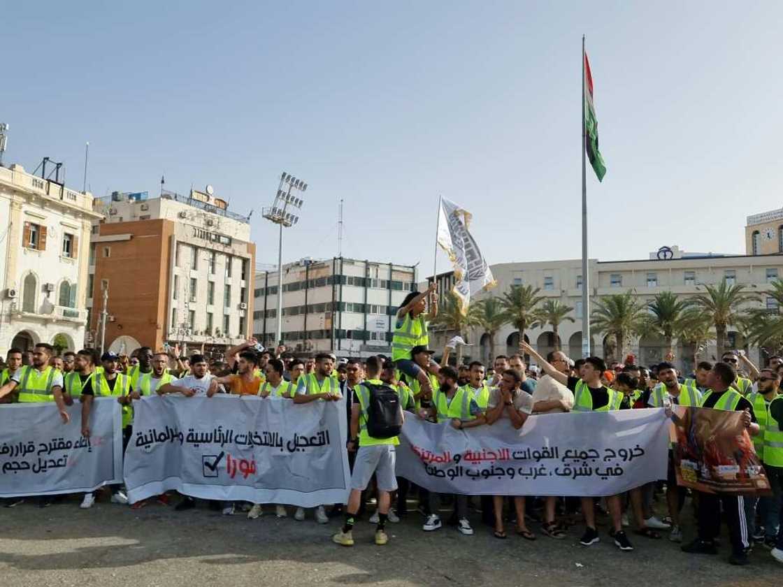 Libyans protest in Martyrs' Square in the heart of the capital Tripoli on Friday Libyans protest in Martyrs' Square in the heart of the capital Tripoli on Friday