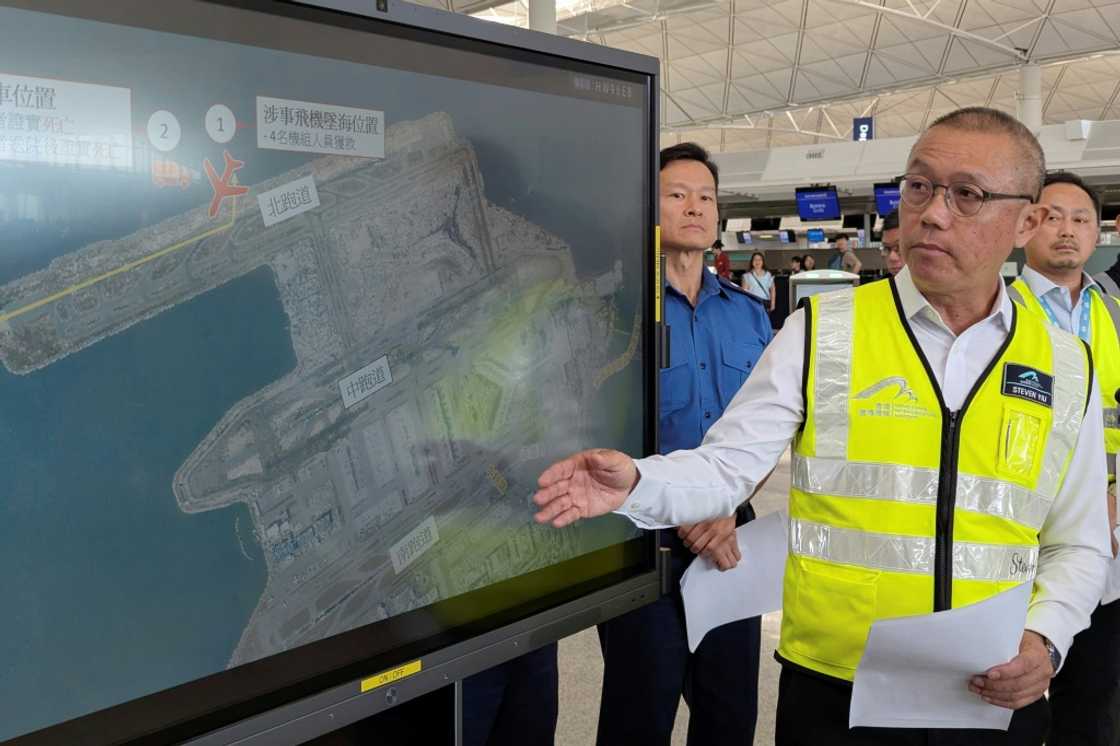 Steven Yiu, Airport Authority Hong Kong's executive director of operations, briefs reporters after a plan skidded off the tarmac Steven Yiu, Airport Authority Hong Kong's executive director of operations, briefs reporters after a plan skidded off the tarmac