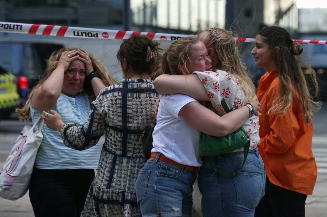 Distraught people gathered outside the shopping centre