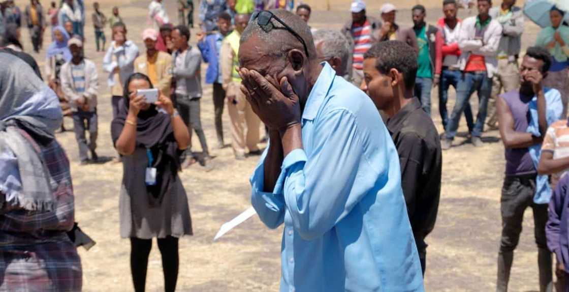 Sad man covering his face Sad man covering his face