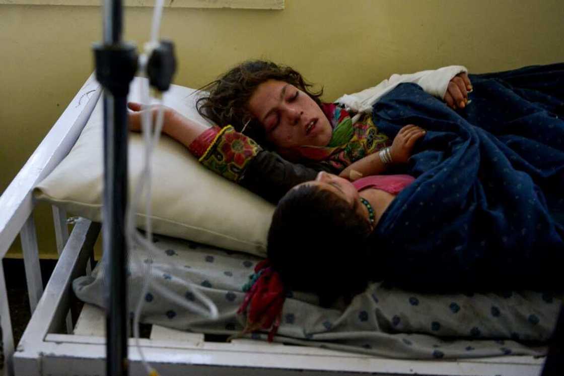 Two injured girls share a hospital bed in Sharan, capital of Paktika province Two injured girls share a hospital bed in Sharan, capital of Paktika province