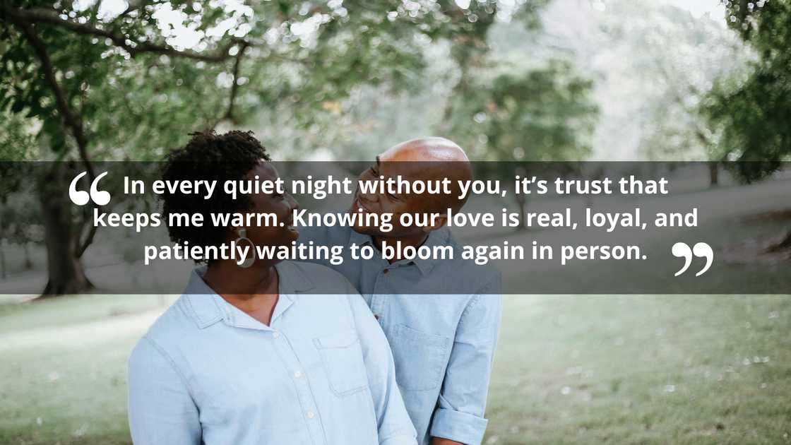 An older couple in matching sky blue shirts looking at each other. An older couple in matching sky blue shirts looking at each other.