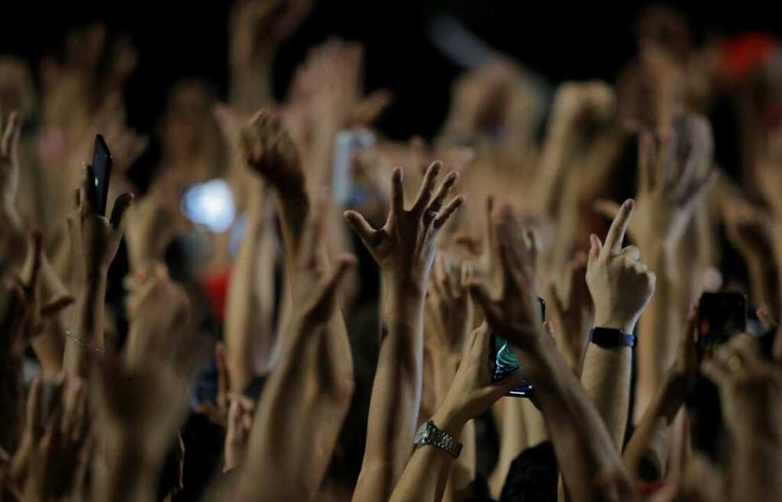 Supporters of Brazilian president-elect Luiz Inacio Lula da Silva in Sao Paulo raise their hands in celebration after the run-off election on October 30 Supporters of Brazilian president-elect Luiz Inacio Lula da Silva in Sao Paulo raise their hands in celebration after the run-off election on October 30