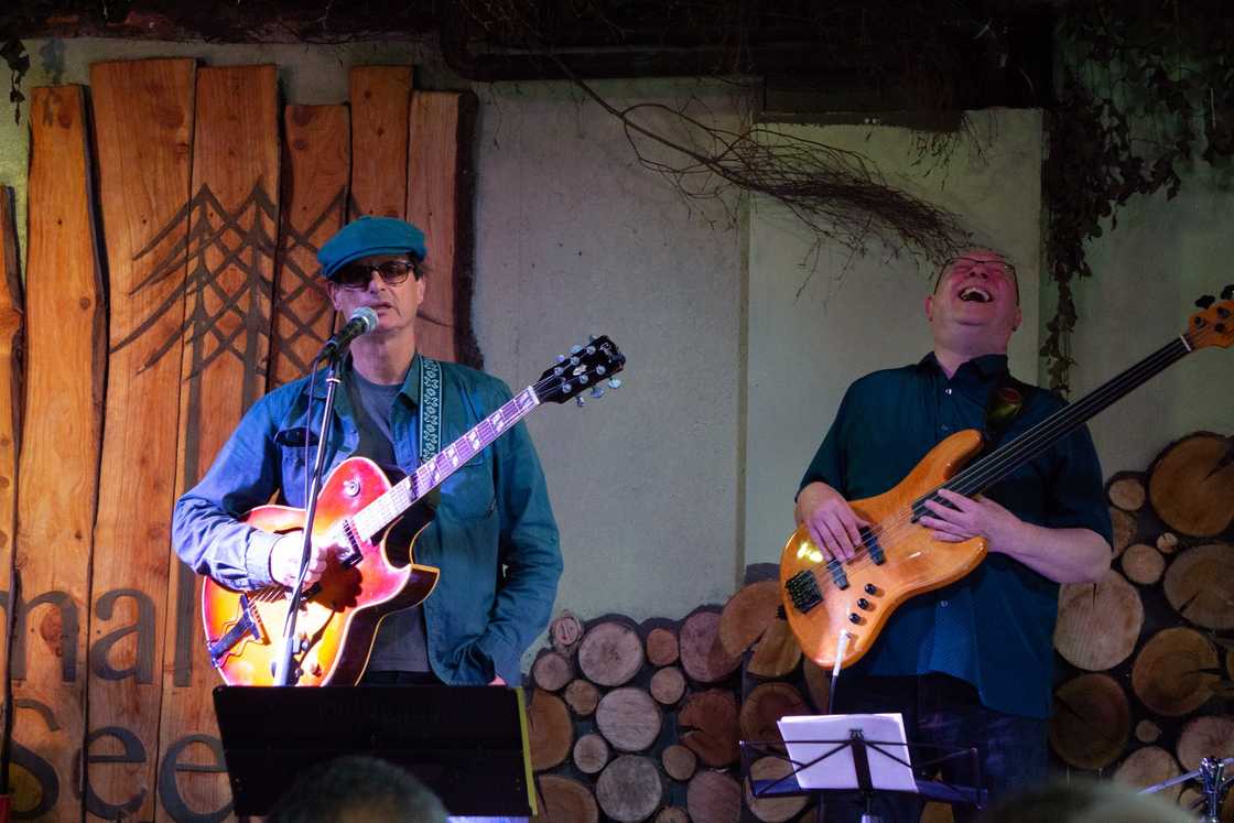 Bass guitarist Larry Van Kriedt (L) during a performance