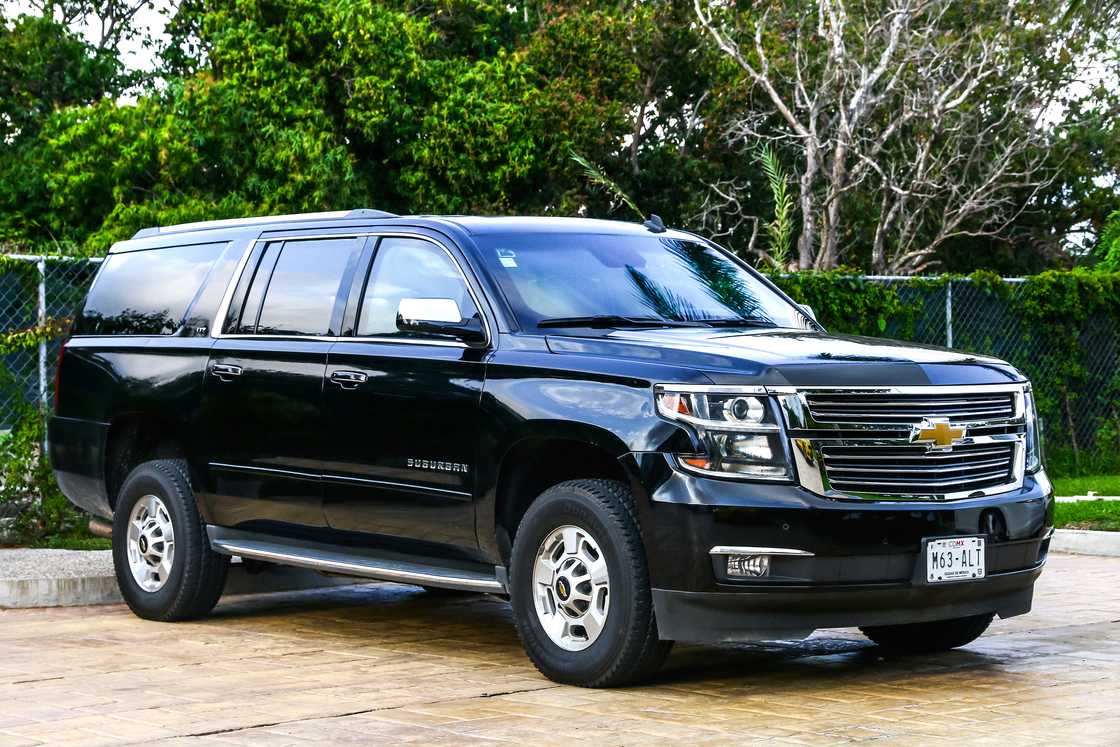 Motor car Chevrolet Suburban in the city street.