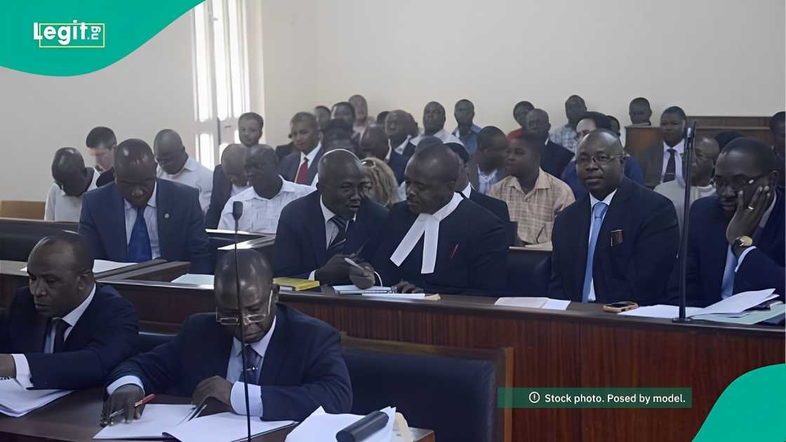 A court room setting with lawyers discussing a late man's estate and inheritance rights. A court room setting with lawyers discussing a late man's estate and inheritance rights.
