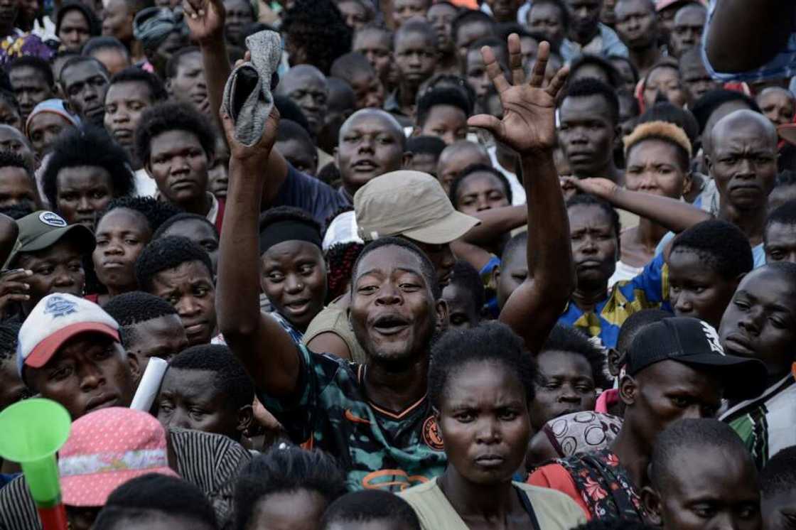 Politicians in Kenya offer cash, umbrellas, shirts, caps and even packets of maize flour to anyone who attends their rallies Politicians in Kenya offer cash, umbrellas, shirts, caps and even packets of maize flour to anyone who attends their rallies