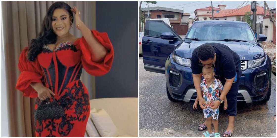 Nkechi poses with her godson in front of her car Nkechi poses with her godson in front of her car