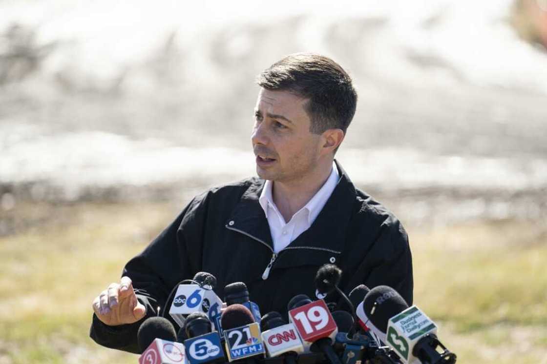 US Transportation Secretary Pete Buttigieg, seen here near the site of a toxic train derailment in East Palestine, Ohio, called on rail companies not to wait for Congress to legislate before introducing safety reforms US Transportation Secretary Pete Buttigieg, seen here near the site of a toxic train derailment in East Palestine, Ohio, called on rail companies not to wait for Congress to legislate before introducing safety reforms