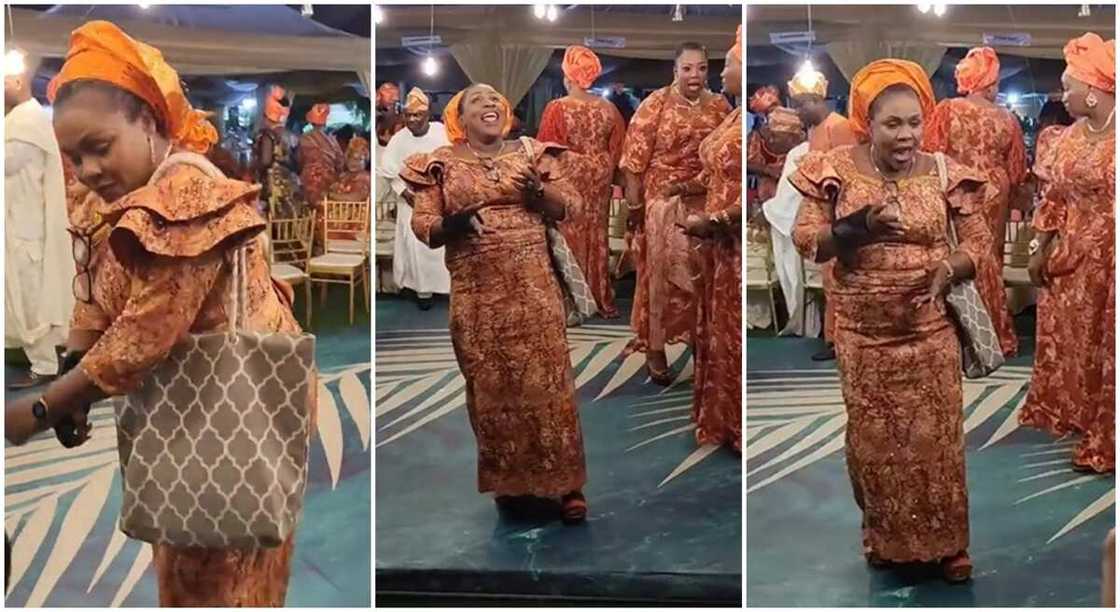 Nigerian woman in beautiful wrapper entertains wedding guests with sweet dance moves. Nigerian woman in beautiful wrapper entertains wedding guests with sweet dance moves.